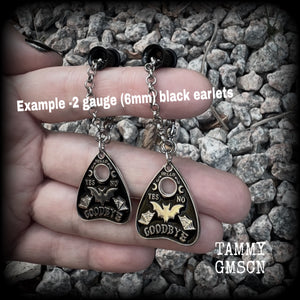These beautiful antique silver and black enamel tunnel dangles are nice and lightweight and nice and dangly, weighing only 4 grams each, and measuring just over 6cms from tip to tip.

🕷️ PLEASE NOTE-This particular chain will not fit through tunnels smaller than 4 gauge (5mm), though I have lots of different chains that will. Get in touch and we can pick something just for you x

💥This listing includes one pair of surgical steel single flared O-ring earlets. 
