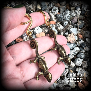 These awesome gauged earrings feature a pair of brass iguanas, are nice and dangly, measuring just on 7.5cms from tip to tip, and weighing approx 13 grams each.

This pair has been made on 6 gauge (4mm) surgical steel full curl hooks, to be worn in stretched lobes.
