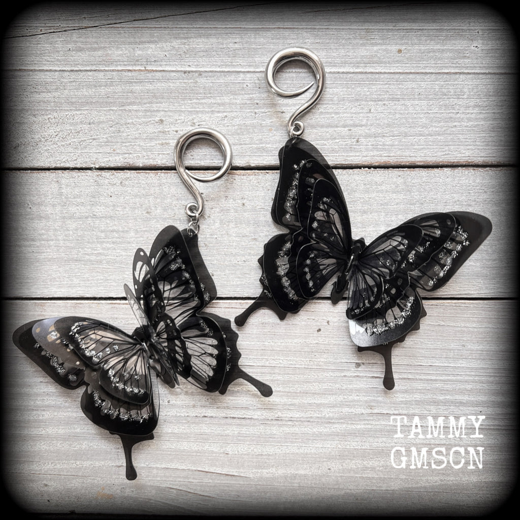 These gorgeous gauged glittery earrings feature beautiful big swallowtail butterflies, super lightweight at just 5 grams a piece, measuring 11cms from tip to tip.

This pair have been made on 6 gauge (4mm) surgical steel full curls, to be worn through stretched lobes.