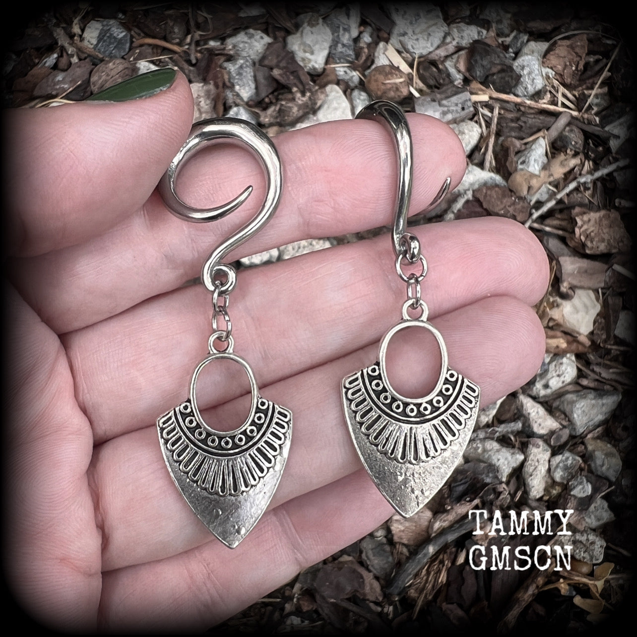 Inspired by Ishtar, Mesopotamian Goddess of love, beauty, sex and war, these beautiful tribal antique silver gauged earrings are nice and light weight, weighing approx 5 grams a piece, and are nice and dangly, measuring just on 6cms from tip to tip.
This pair has been made on 6 gauge (4mm) surgical steel full curl hooks, to be worn in stretched lobes.