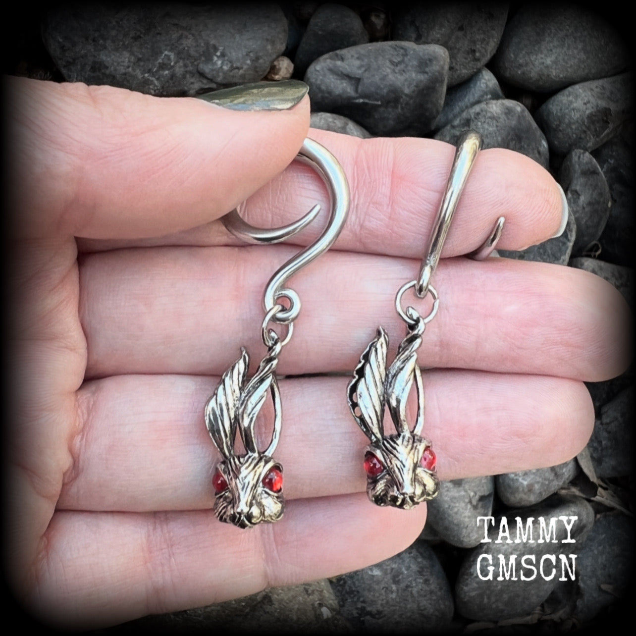 Featuring super cute, slightly creepy antique silver zombie rabbits complete with red eyes, these earrings weigh 7 grams each, and are lovely and dangly at approx 5.5cms from tip to tip.

This pair has been made on 6 gauge (4mm) surgical steel full curl hooks, to be worn in stretched lobes.