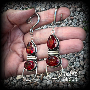 These stunning dangly gauged earrings feature gorgeous deep red faceted garnet gemstones in an ornate antique silver hinged setting, measuring just over 8cms from tip to tip, and weigh approx 10 grams each.  This pair have been made with 6 gauge (4mm) surgical steel full curl hooks, to be worn in stretched lobes.