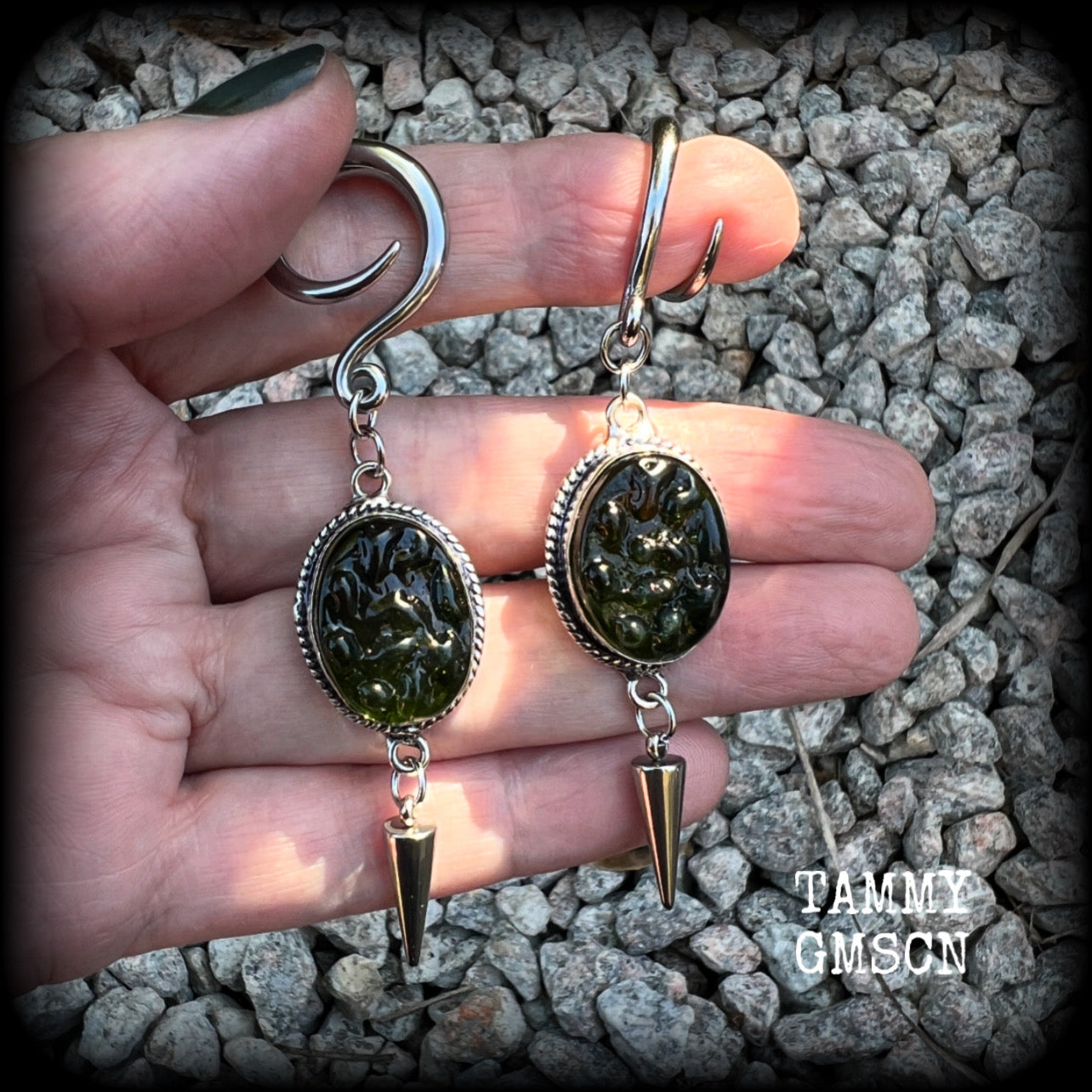 This pair of earrings features gorgeous forest green moldavite gemstones in a boho antique silver setting, weighing approx 10 grams a piece and measuring just on 8cms from tip to tip.  This pair have been made on 6 gauge (4mm) surgical steel full curl hooks, to be worn in stretched lobes.