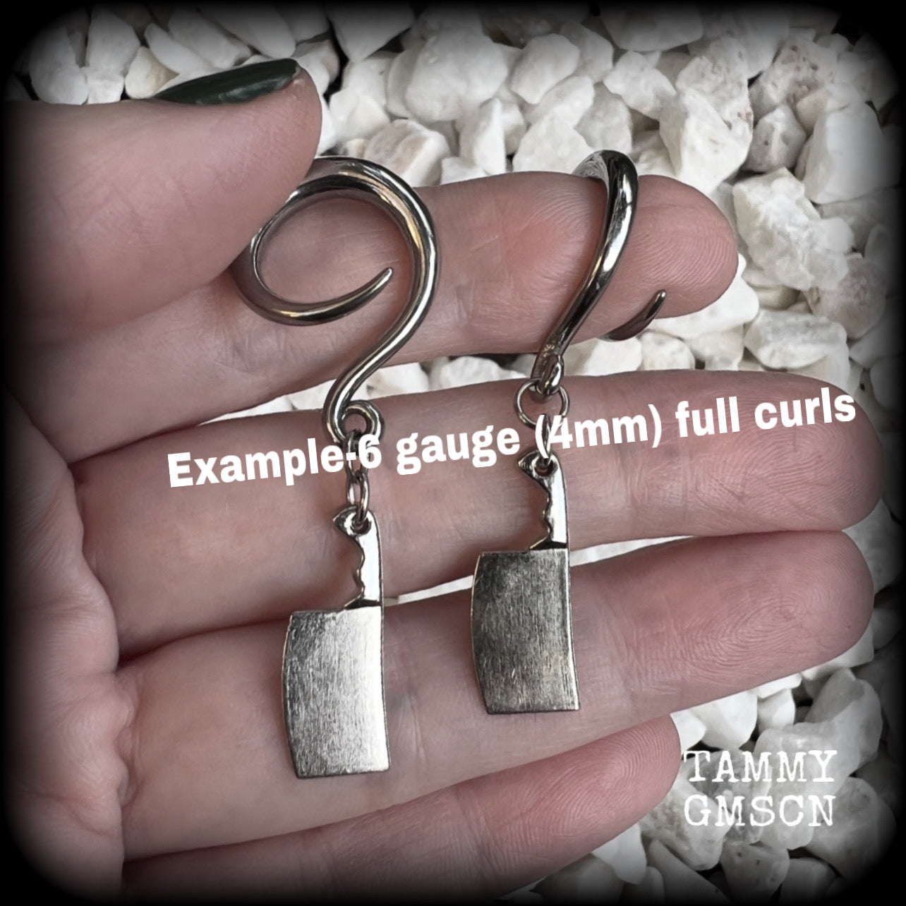 Featuring a pair of awesome antique silver meat cleavers, these earrings are super lightweight, weighing in at only 5 grams a piece, and are nice and dangly at just on 5.5cms.

🩸 Do you want a bit of b l o o d on your meat cleavers? Please just let us know!

This pair has been made on 6 gauge (4mm) surgical steel full curl hooks, to be worn in stretched lobes.