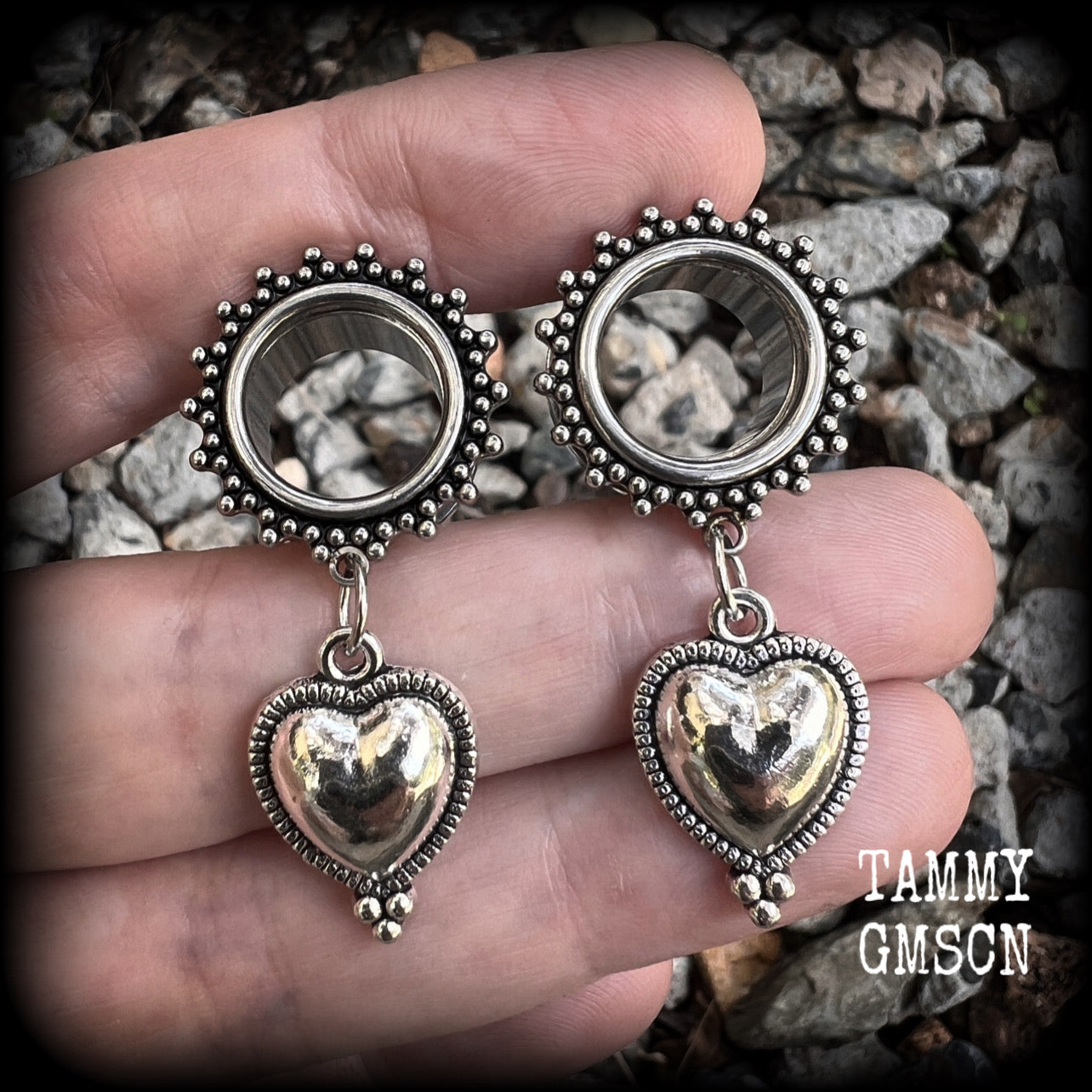 These gorgeous tunnel earrings feature beautiful antique silver hearts, are nice and lightweight, weighing only 7 grams each and measure approx 4.5cms from tip to tip.
This pair has been made with 9/16" (14mm) gauge ornate surgical steel screw fit tunnels.