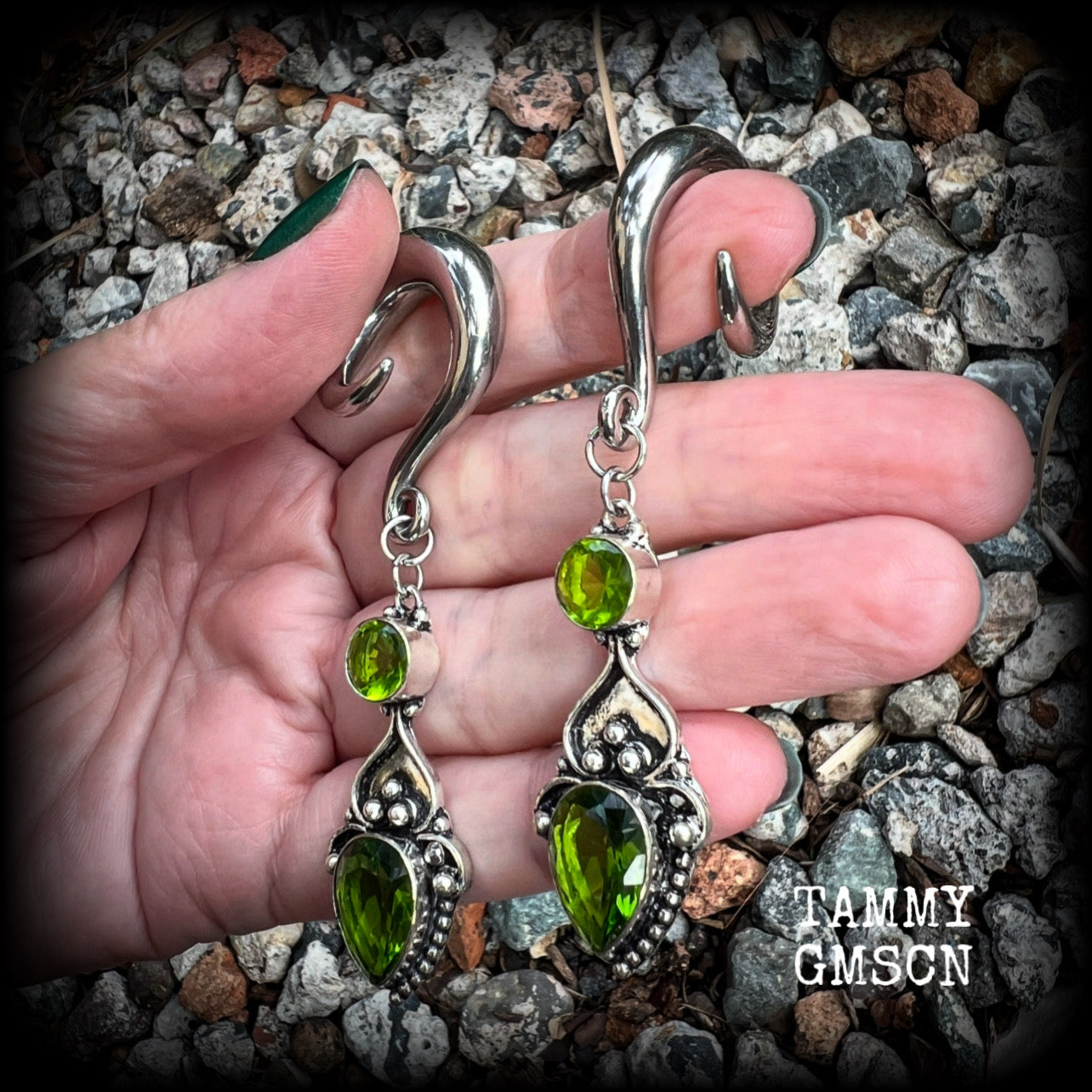 This pair of earrings features gorgeous green quartz and peridot gemstones in a boho antique silver setting, weighing approx 19 grams a piece and measuring just on 8.5cms from tip to tip.  This pair have been made on 0 gauge (8mm) surgical steel full curl hooks, to be worn in stretched lobes.