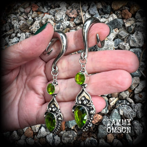 This pair of earrings features gorgeous green quartz and peridot gemstones in a boho antique silver setting, weighing approx 19 grams a piece and measuring just on 8.5cms from tip to tip.  This pair have been made on 0 gauge (8mm) surgical steel full curl hooks, to be worn in stretched lobes.