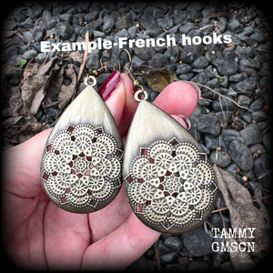These beautiful teardrop earrings feature an intricate antique bronze mandala, are nice and light weight, weighing 6 grams each, and measuring just on 7 cms from tip to tip.
This pair have been made with antique french hooks, suitable for pierced ears.