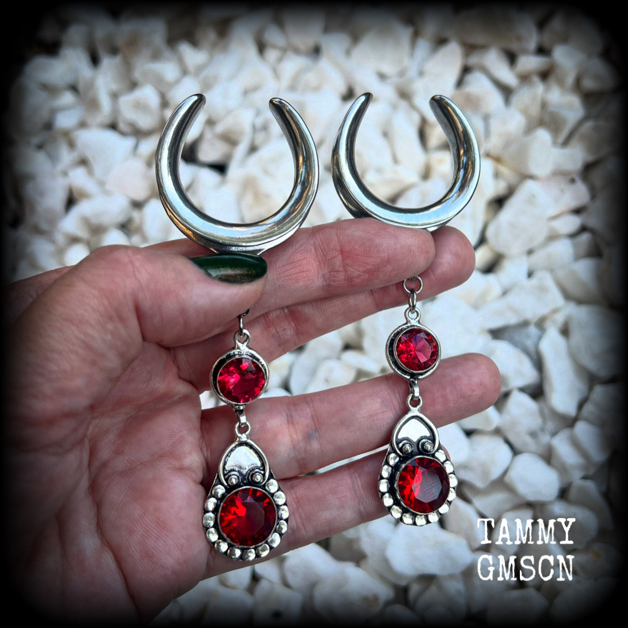These beautiful boho Garnet ear hangers are made with gorgeous facet gemstones in a beautiful boho antique silver setting, measuring just on 10cm from tip to tip, and weighing 18 grams each, nice and lightweight. 

These earrings have been made on 1.18" gauge (30mm) surgical steel cradles, to be worn in stretched lobes.
