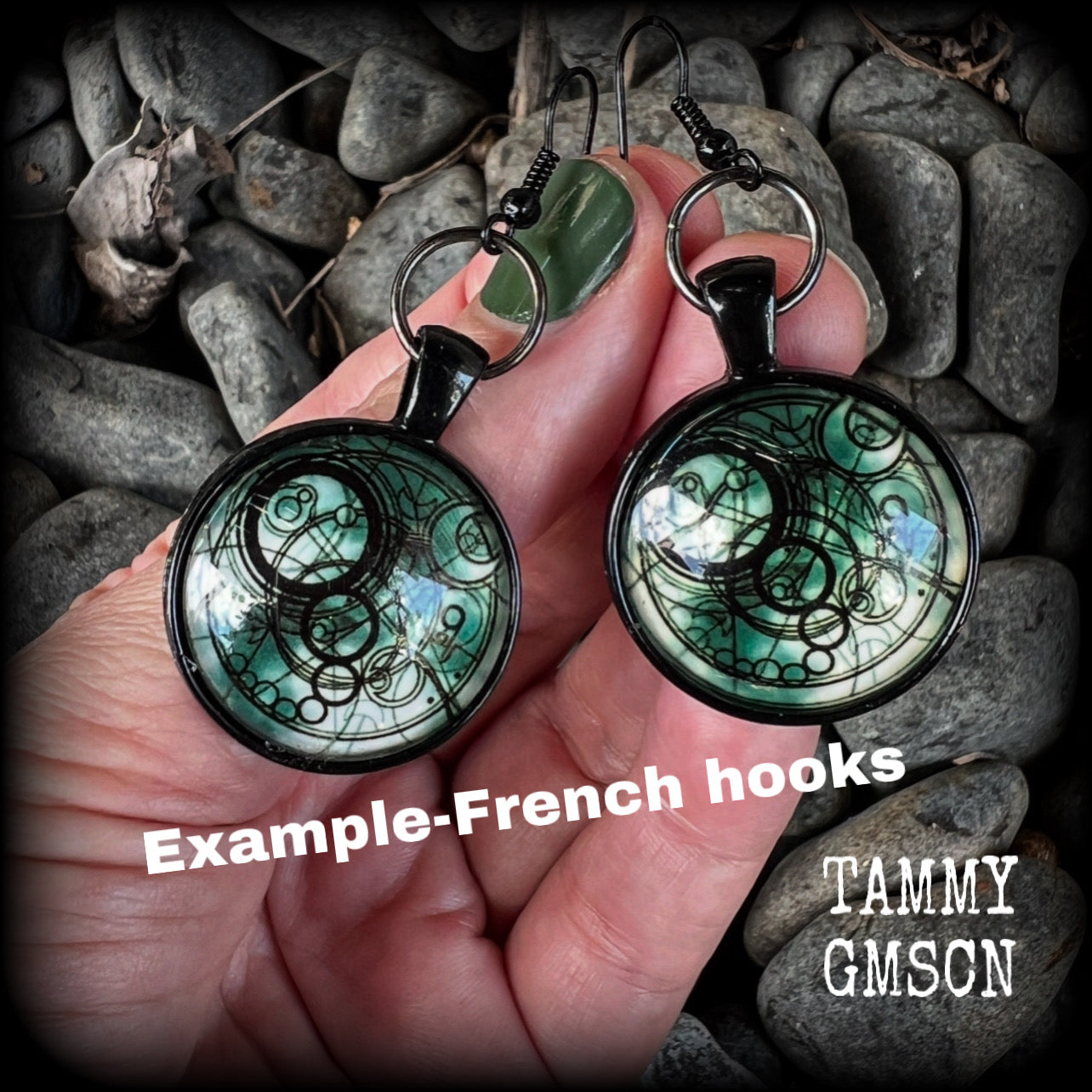 These awesome earrings feature a Dr Who inspired Gallifreyan steampunk sigil enclosed in a shiny resin dome, nice and dangly at just over 6cms from tip to tip, and weighing approx 8 grams a piece.
This pair has been made on french hooks, suitable for pierced ears.