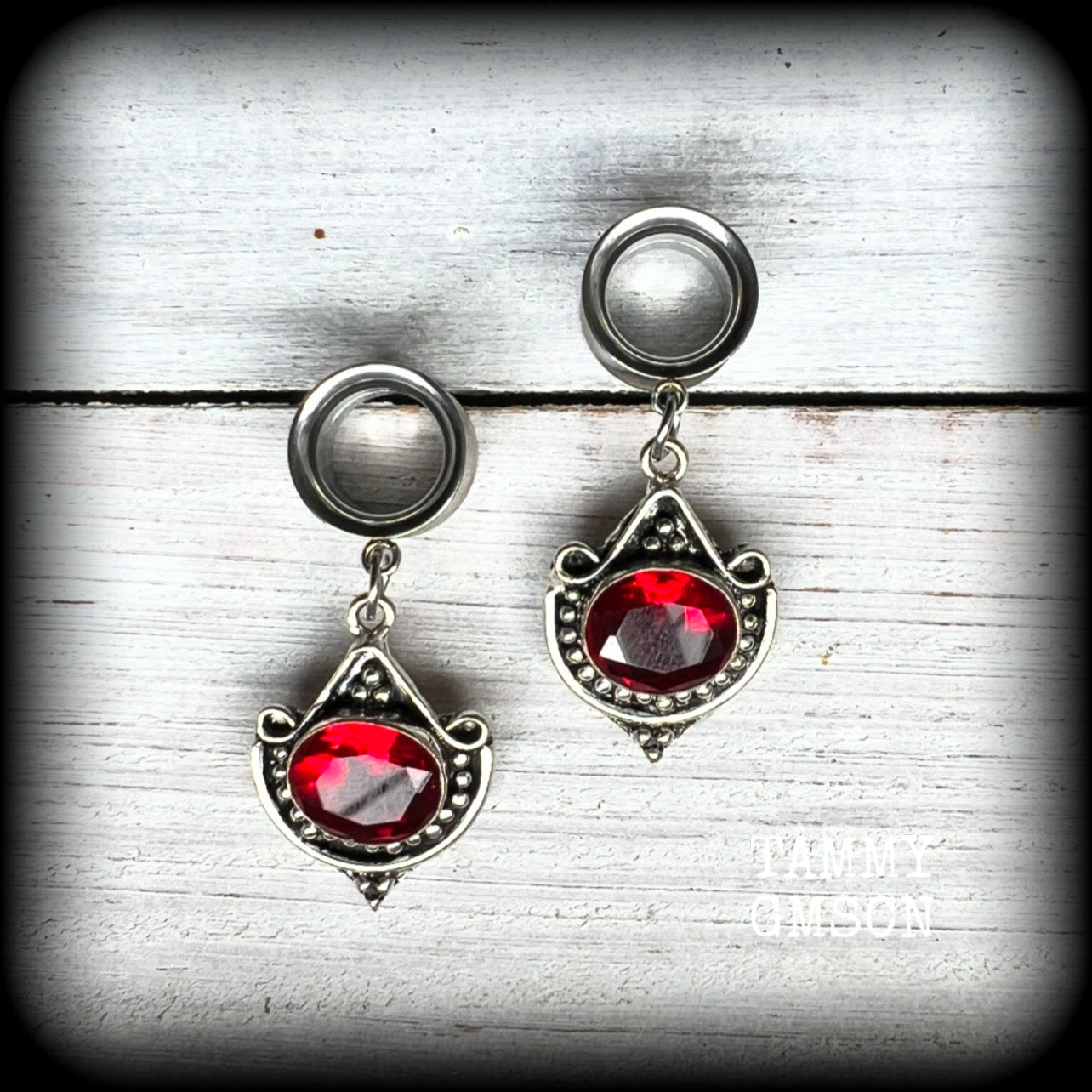 These beautiful earrings have been made with gorgeous deep red garnet gemstones in a beautiful boho antique silver setting, are nice and light weight, weighing approx 6 grams each and measuring 4.5 from tip to tip.

These gorgeous tunnel dangles have been made with 1/2" (12mm) gauge surgical steel screw fit earlets.