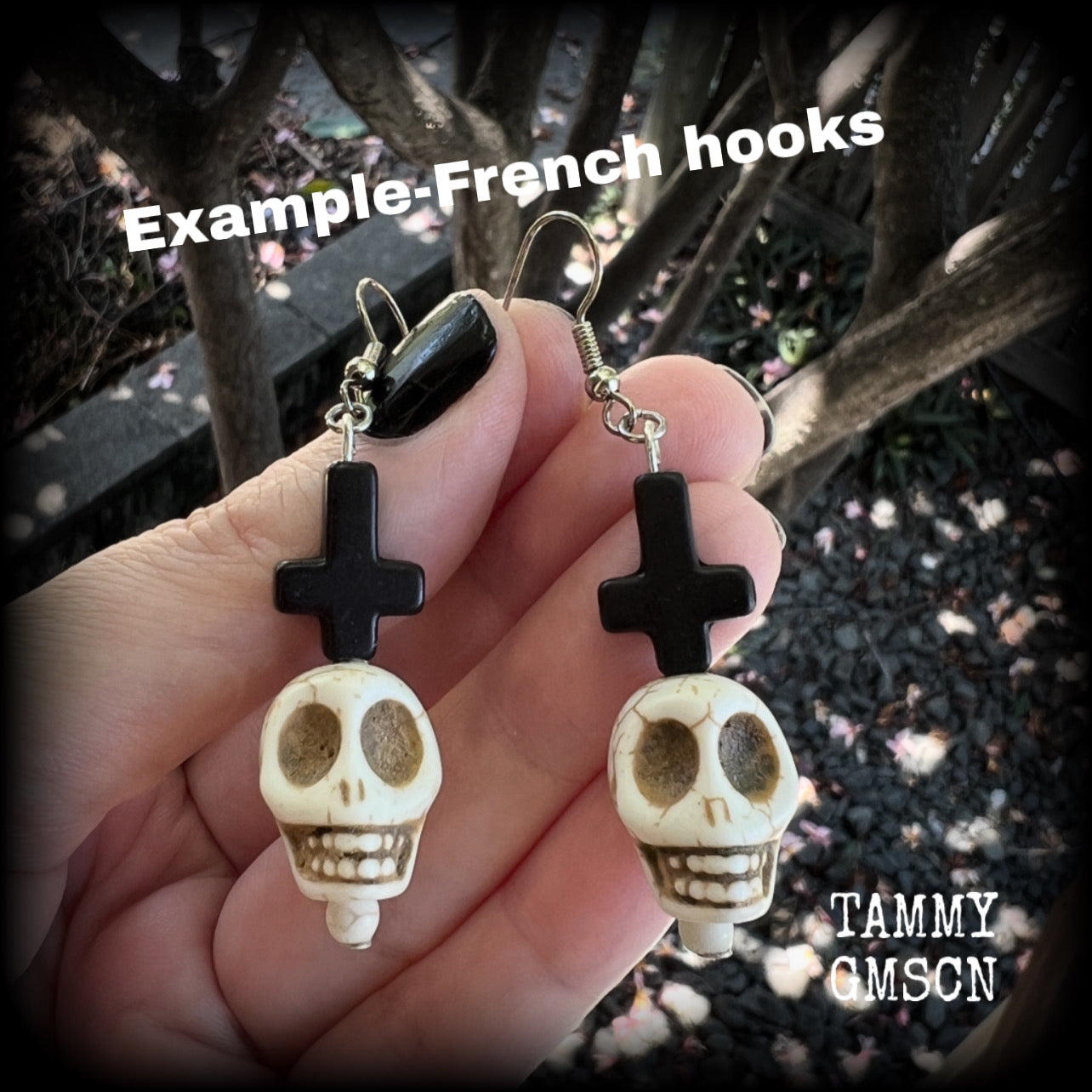 Inspired by Baron Samedi these earrings features pitch black inverted crosses with bone white skulls, measuring 7cms from tip to tip and weighing 7 grams a piece.

This pair have been made with stainless steel french hooks, suitable for pierced ears.