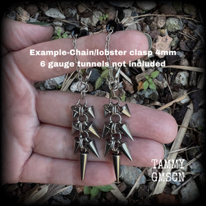 Measuring approx 8cm from top to bottom, these awesome dangly stainless steel punk rock metal spike tunnel earrings are nice and also nice and lightweight, at 7grams a piece.

This pair has been made on our super versatile chain/lobster clasp 4mm option, suitable when worn through tunnel or earlets in stretched lobes from 6 gauge (4mm).