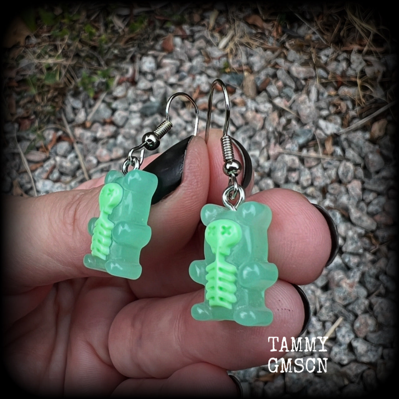 Featuring spooky cute green skeleton gummy bears, these adorable earrings measure just on 5cms from tip to tip and are super light weight, weighing only a gram or two each.

This pair has been made with stainless steel french hooks, to be worn in pierced ears.