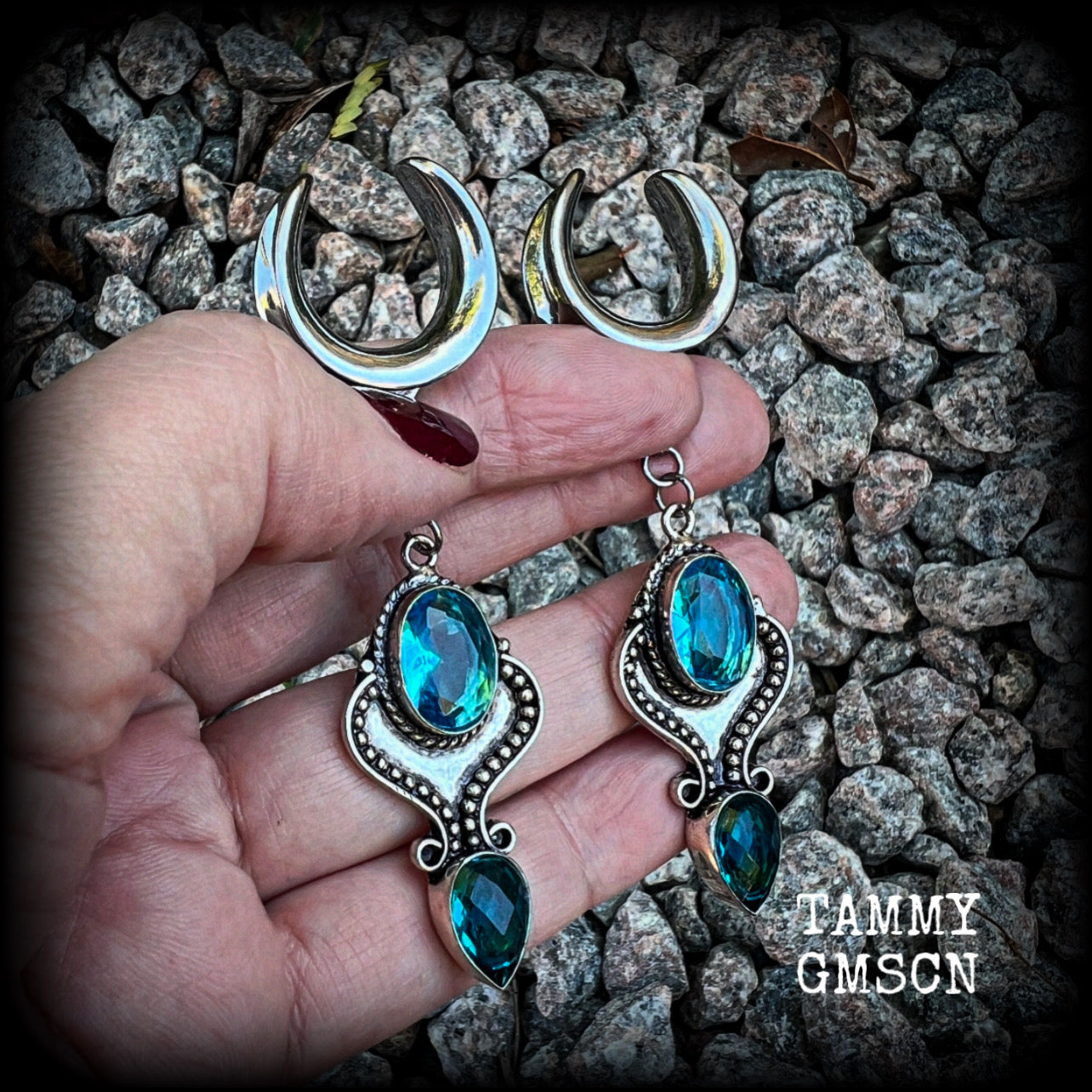 These earrings feature gorgeous facet blue topaz gemstones in a beautiful boho antique silver setting, lovely and dangly at just on 8cms from tip to tip, and not too heavy at 12 grams each.

These earrings have been made on 3/4” gauge (19mm) surgical steel cradles, to be worn in stretched lobes.