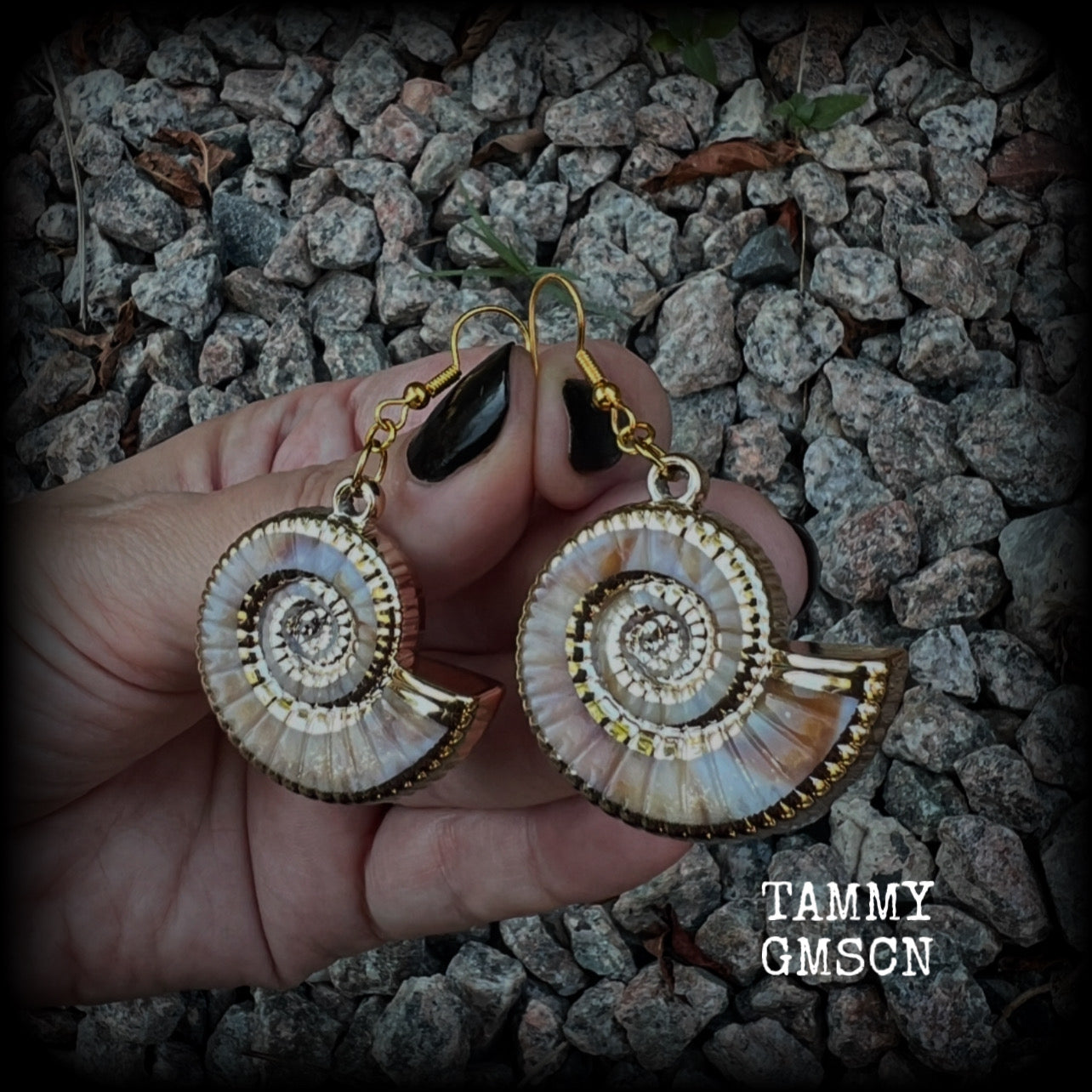 This pair of earrings feature gorgeous acrylic nautilus sea shells, super lightweight- weighing 6 grams each, measuring just approx 6cms from tip to tip. 

These beautiful earrings have been made with antique gold french hooks-for pierced ears.