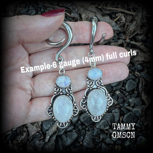 These gemstone earrings feature beautiful big rainbow moonstones in a beautiful antique silver setting.  These earrings are lovely and dangly measuring 8cms from tip to tip, and weighing 14 grams each. Made on 2 gauge (6mm) surgical steel full curls.