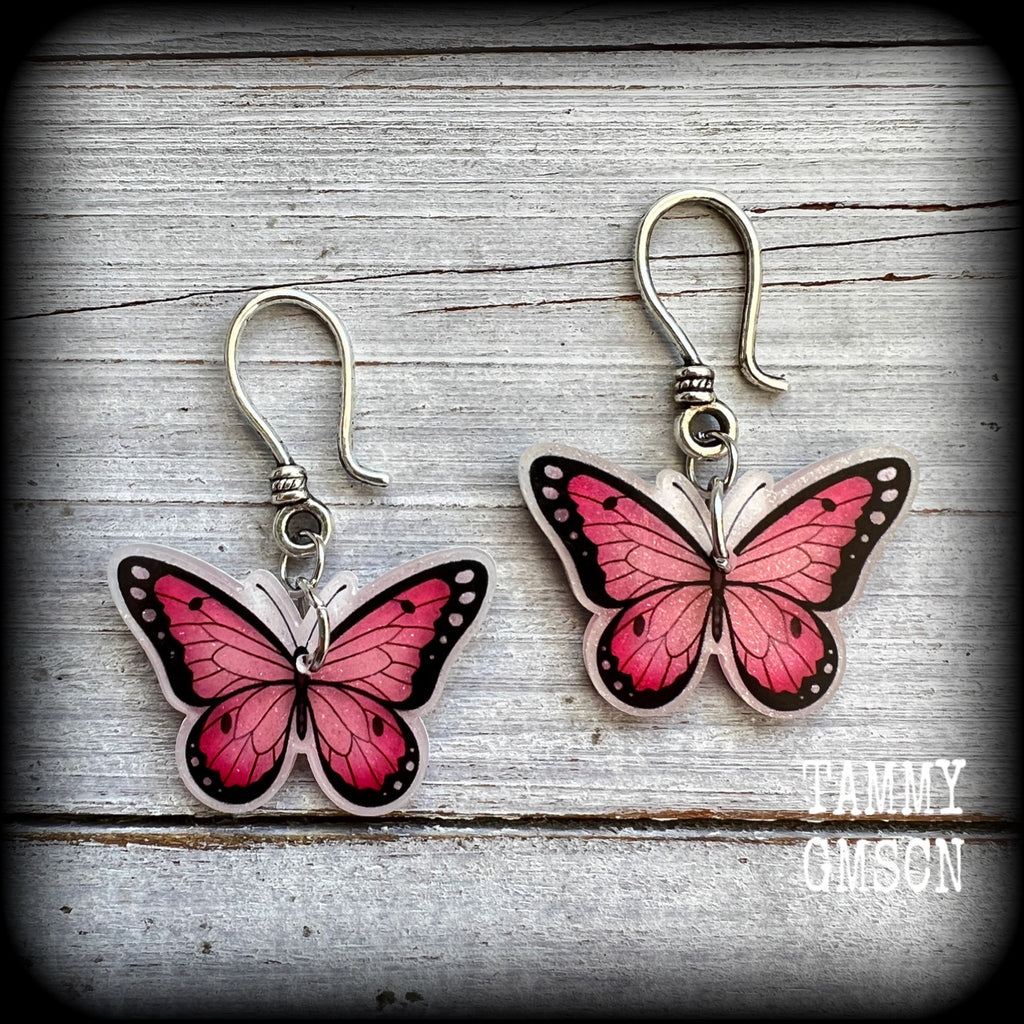 This is a pair of beautiful pink butterfly earrings, available on a selection of hooks and clasps for pierced ears and stretched lobes.