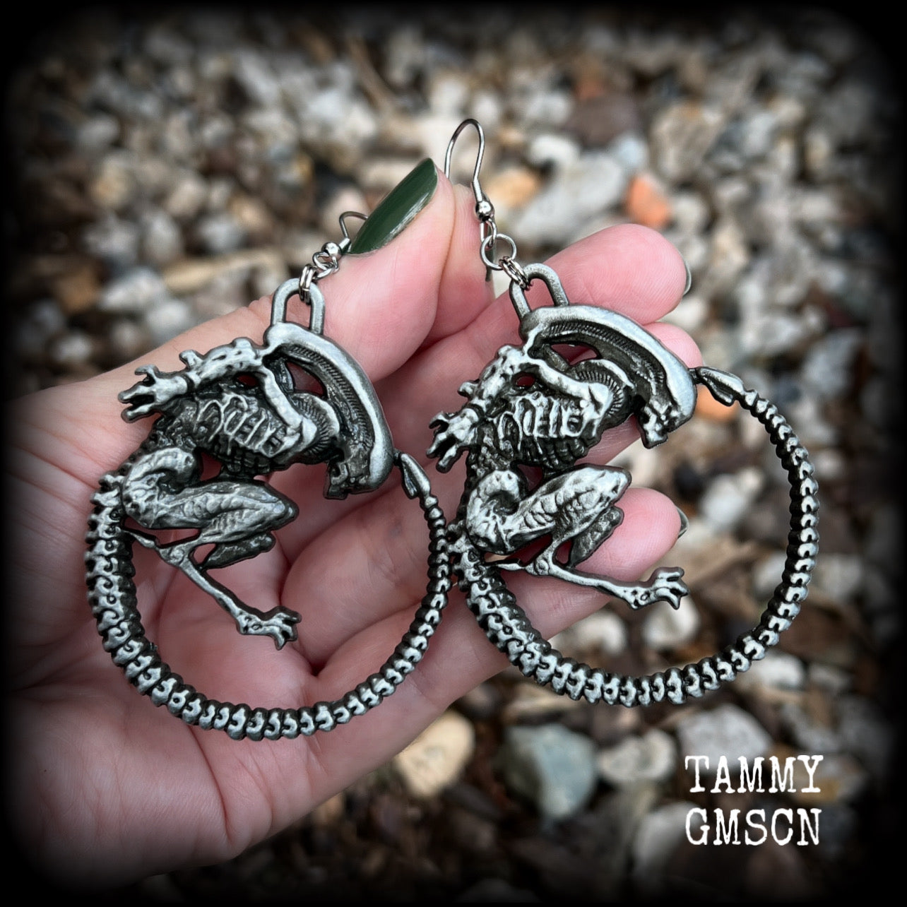 This pair of awesome earrings features large Alien Queen Xenomorphs, measuring 8.5cms from tip to tip (nice and big), and weigh 35 grams each (these are HEAVY).

This pair have been made with stainless steel french hooks-suitable for pierced ears.