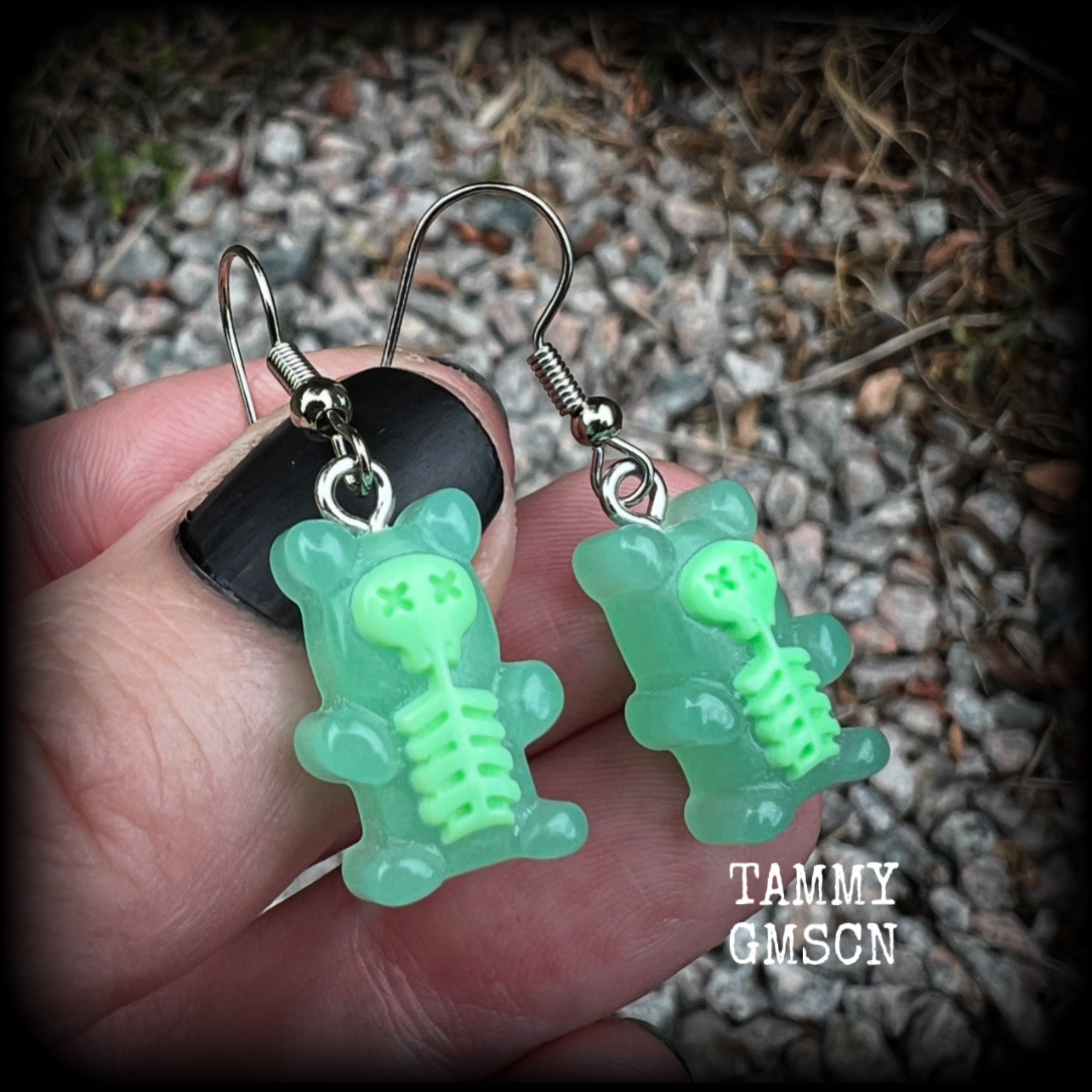 Featuring spooky cute green skeleton gummy bears, these adorable earrings measure just on 5cms from tip to tip and are super light weight, weighing only a gram or two each.

This pair has been made with stainless steel french hooks, to be worn in pierced ears.