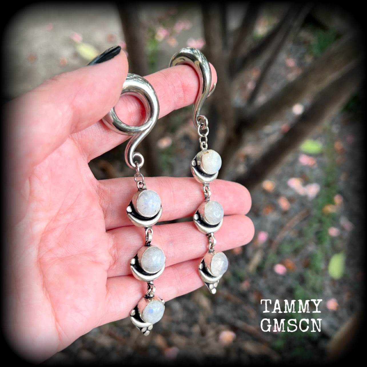 These beautiful boho Rainbow moonstone earrings are made with gorgeous polished gemstones, lovely and dangly measuring approx 10cms from tip to tip, and weighing approx 21 grams each. 

These earrings have been made on 00 gauge (10mm) surgical steel full curl hooks, to be worn in stretched lobes.