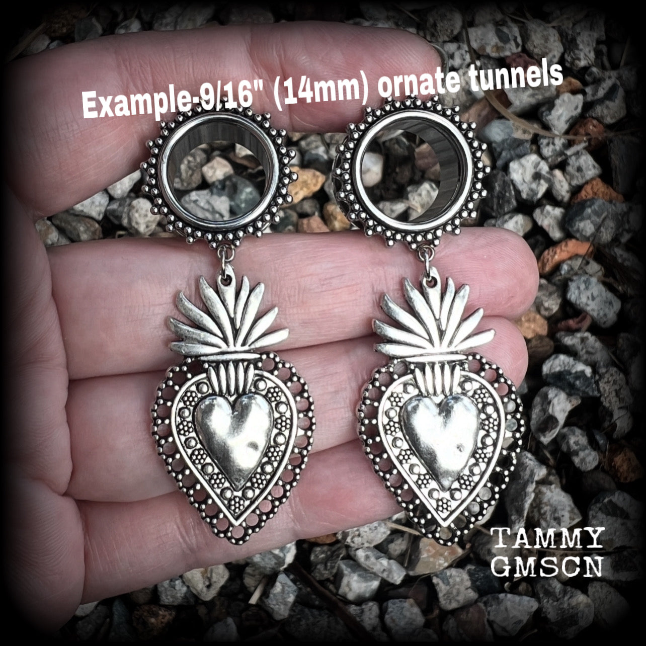 These gorgeous tunnel earrings feature beautiful antique silver sacred hearts, are nice and lightweight, weighing approx 10 grams each and measure just under 7cms from tip to tip.

This pair has been made with 9/16" (14mm) gauge ornate surgical steel screw fit tunnels.