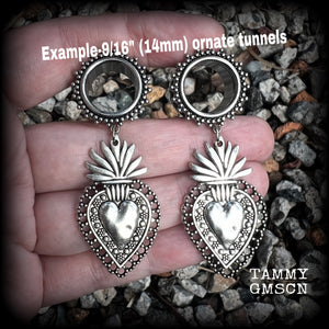 These gorgeous tunnel earrings feature beautiful antique silver sacred hearts, are nice and lightweight, weighing approx 10 grams each and measure just under 7cms from tip to tip.

This pair has been made with 9/16" (14mm) gauge ornate surgical steel screw fit tunnels.