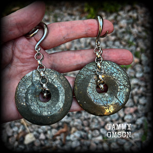 These beautiful big gauged earrings feature gorgeous Pyrite donut gemstones cradles in chunky antique silver chain, measuring just over 9cms from tip to tip, and weighing approx 55 grams each.

This pair has been made on 2 gauge (6mm) surgical steel full curls, to be worn in stretched lobes.