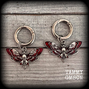 These awesome boot charms feature antique silver and enamel gothic red deaths-head hawkmoth charms, measuring 4.5cms across and 5.5cms from top to bottom.

Made to last, all our boot charms are made with super sturdy snap rings and strong jump rings.


