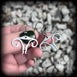 These amazing earrings feature offensive stainless steel female reproductive organs giving the middle finger! Nice and lightweight, weighing only a few grams each, these earrings measure approx 3.5cms from tip to tip.

This pair have been made on stainless steel french hooks, for pierced ears.