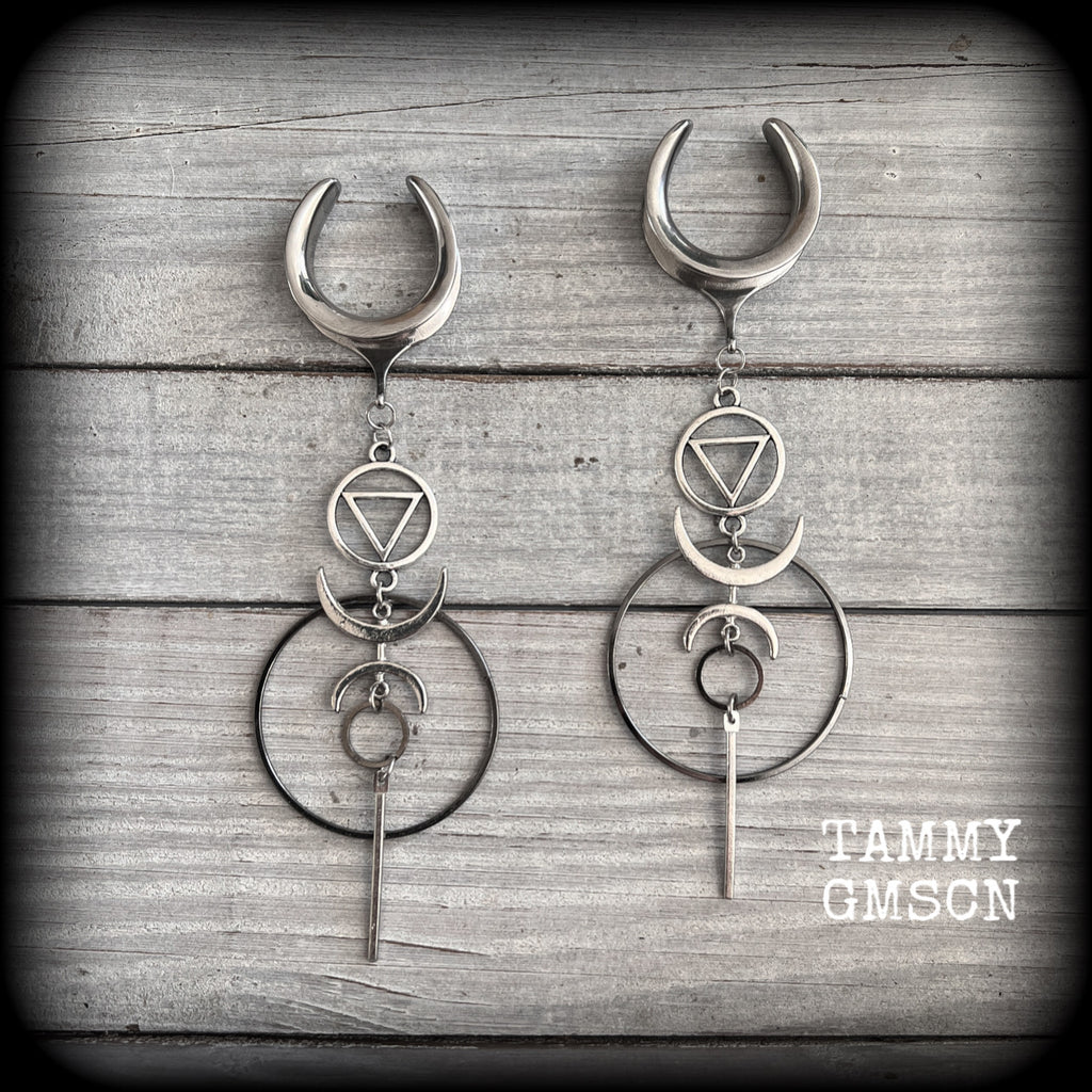 These gorgeous earrings feature beautiful hoops and crescent moons hanging from the elemental symbol for water, weighing approx 12 grams each, measuring just over 13 cms from tip to tip.
This pair has been made on 1" gauge stainless steel cradles.