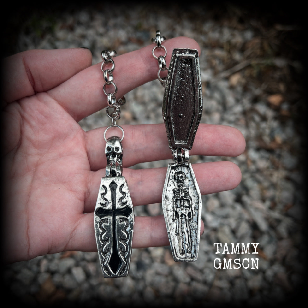 These beautiful antique silver and black enamel coffin tunnel dangles are nice and dangly, weighing approx 25 grams each, and measuring just over 11cms from tip to tip.

⚰️ This listing is for a chunky chain/lobster clasp combination suitable for 00 gauge and larger. 
If you choose a smaller size of tunnel than 00 gauge we will make these on a smaller chain.