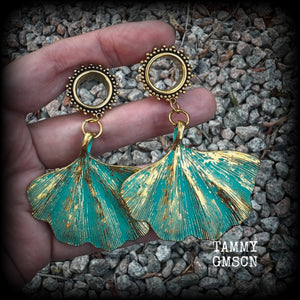 These beautiful boho tunnel earrings feature gorgeous patina ginkgo leaves, weighing approx 16 grams each and measuring  just under 7.5cms from tip to tip.

This pair has been made with 9/16” gauge (14mm) ornate surgical steel screw fit tunnels.