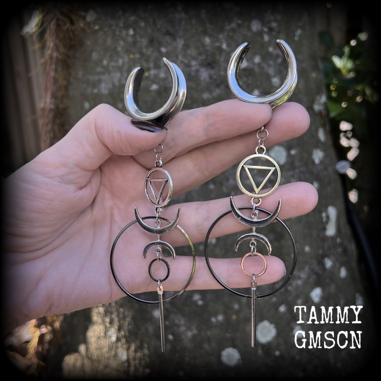 These gorgeous earrings feature beautiful hoops and crescent moons hanging from the elemental symbol for water, weighing approx 12 grams each, measuring just over 13 cms from tip to tip.
This pair has been made on 1" gauge stainless steel cradles.