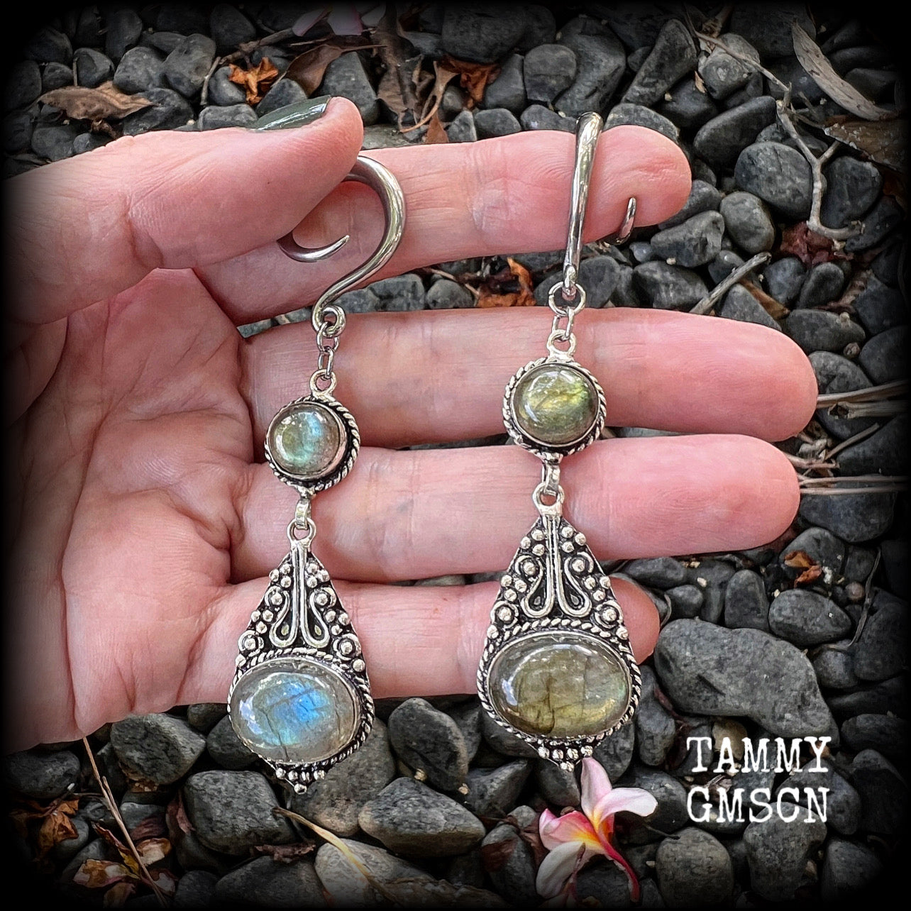 Made with shimmering polished labradorite gemstones, measuring 8.5cms from tip to tip, and weighing approx 10 grams each, not too heavy...
These earrings have been made on 6 gauge (4mm) surgical steel full curl hooks, to be worn in stretched lobes.