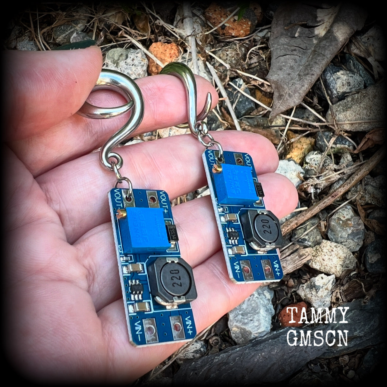 These awesome earrings feature pieces of blue circuitry, are nice and dangly, measuring just on 7cms from tip to tip, and nice and light weight, weighing approx 12 grams each.

This pair has been made on 2 gauge (6mm) surgical steel full curl hooks, to be worn in stretched lobes.