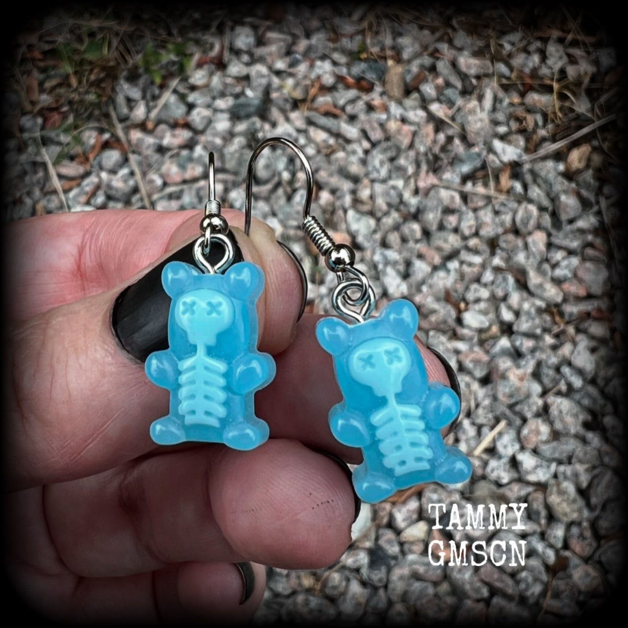 Featuring spooky cute blue skeleton gummy bears, these adorable earrings measure just on 5cms from tip to tip and are super light weight, weighing only a gram or two each.

This pair has been made with stainless steel french hooks, to be worn in pierced ears.
