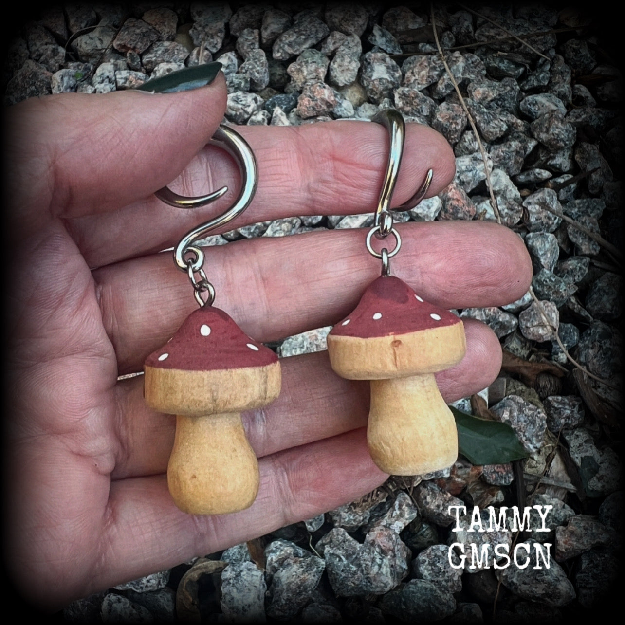 This pair of earrings features gorgeous dusty pink wood mushrooms, nice and light weight at 7 grams a piece, and nice and dangly at just on 6.5cms from tip to tip.

This pair has been made on 6 gauge (4mm) surgical steel full curl hooks, suitable for stretched lobes.