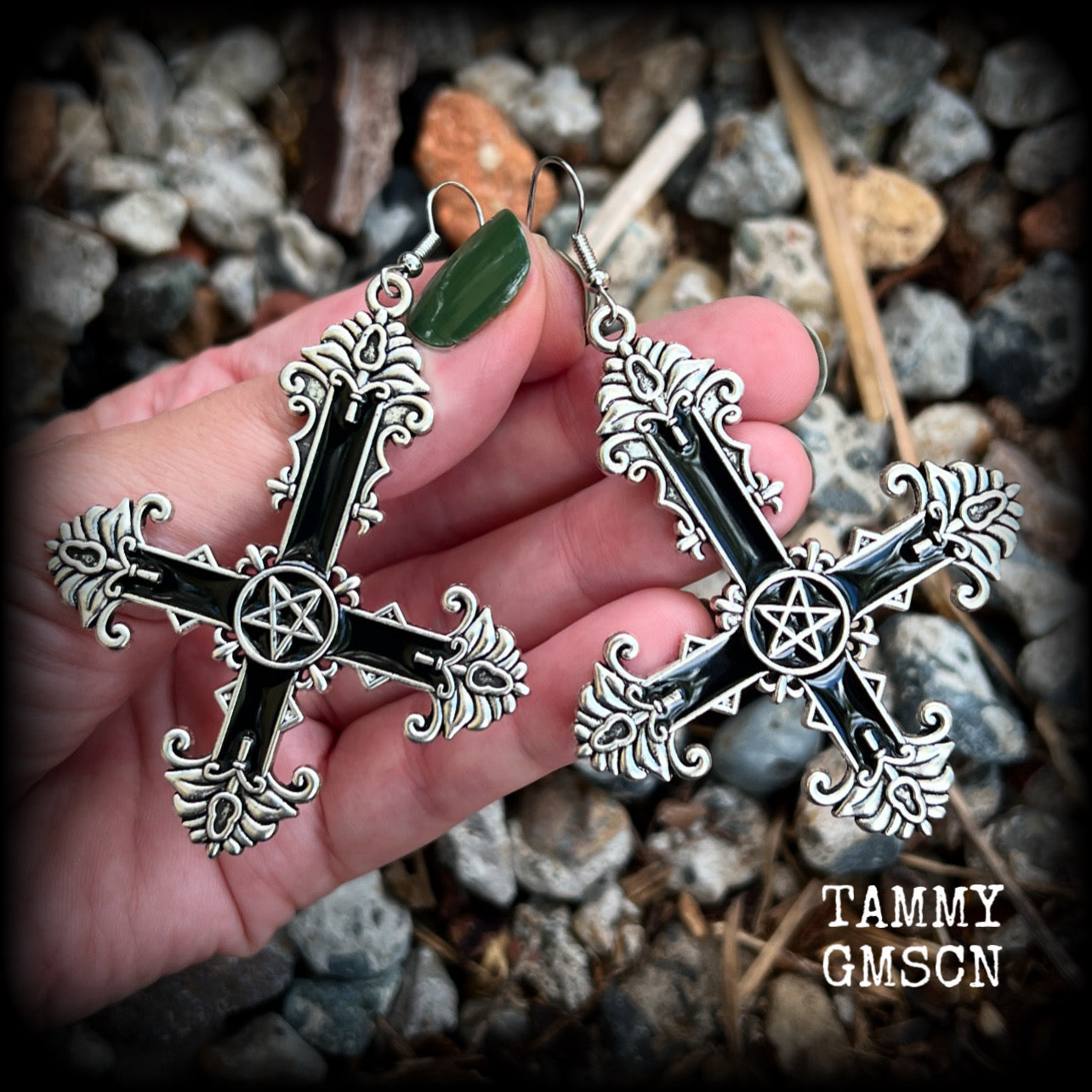 These gorgeous gothic earrings feature a black enamel inverted cross with a silver inverted pentagram, measuring just on 8.5 cms from tip to tip, and weigh approx 10 grams a piece.

This pair have been made on stainless steel french hooks, suitable for pierced ears.