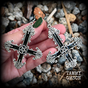 These gorgeous gothic earrings feature a black enamel inverted cross with a silver inverted pentagram, measuring just on 8.5 cms from tip to tip, and weigh approx 10 grams a piece.

This pair have been made on stainless steel french hooks, suitable for pierced ears.