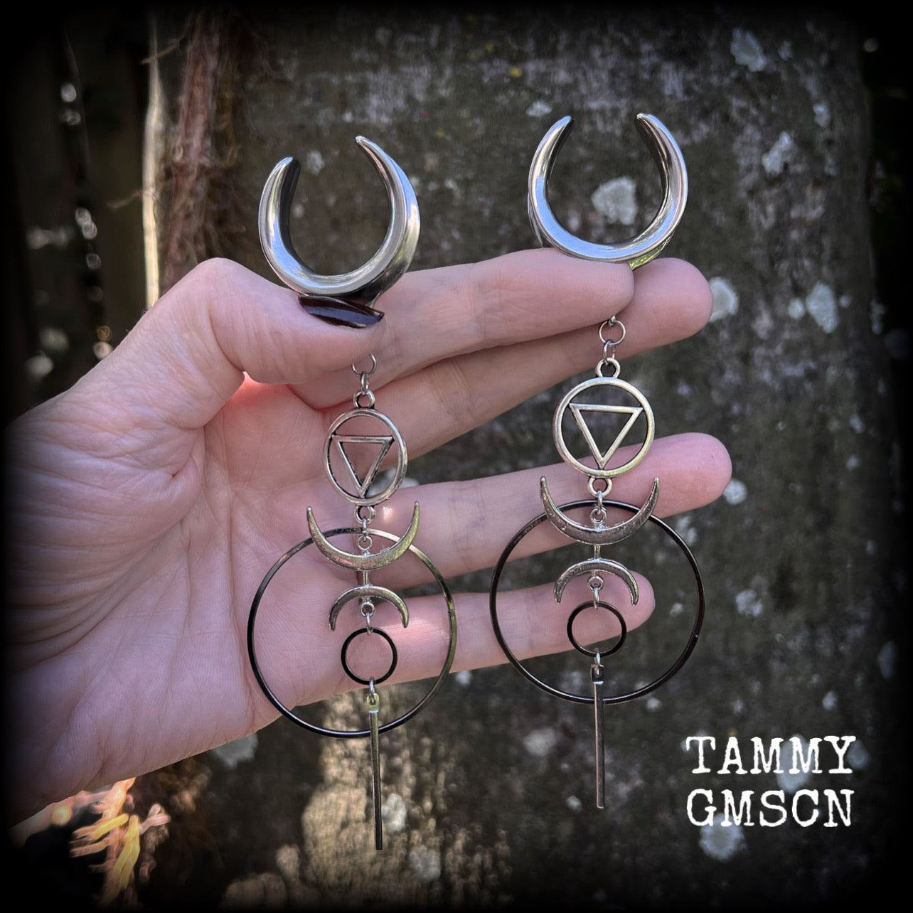 These gorgeous earrings feature beautiful hoops and crescent moons hanging from the elemental symbol for water, weighing approx 12 grams each, measuring just over 13 cms from tip to tip.
This pair has been made on 1" gauge stainless steel cradles.