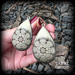 These beautiful teardrop earrings feature an intricate antique bronze mandala, are nice and light weight, weighing 6 grams each, and measuring just on 7 cms from tip to tip.
This pair have been made with antique french hooks, suitable for pierced ears.
