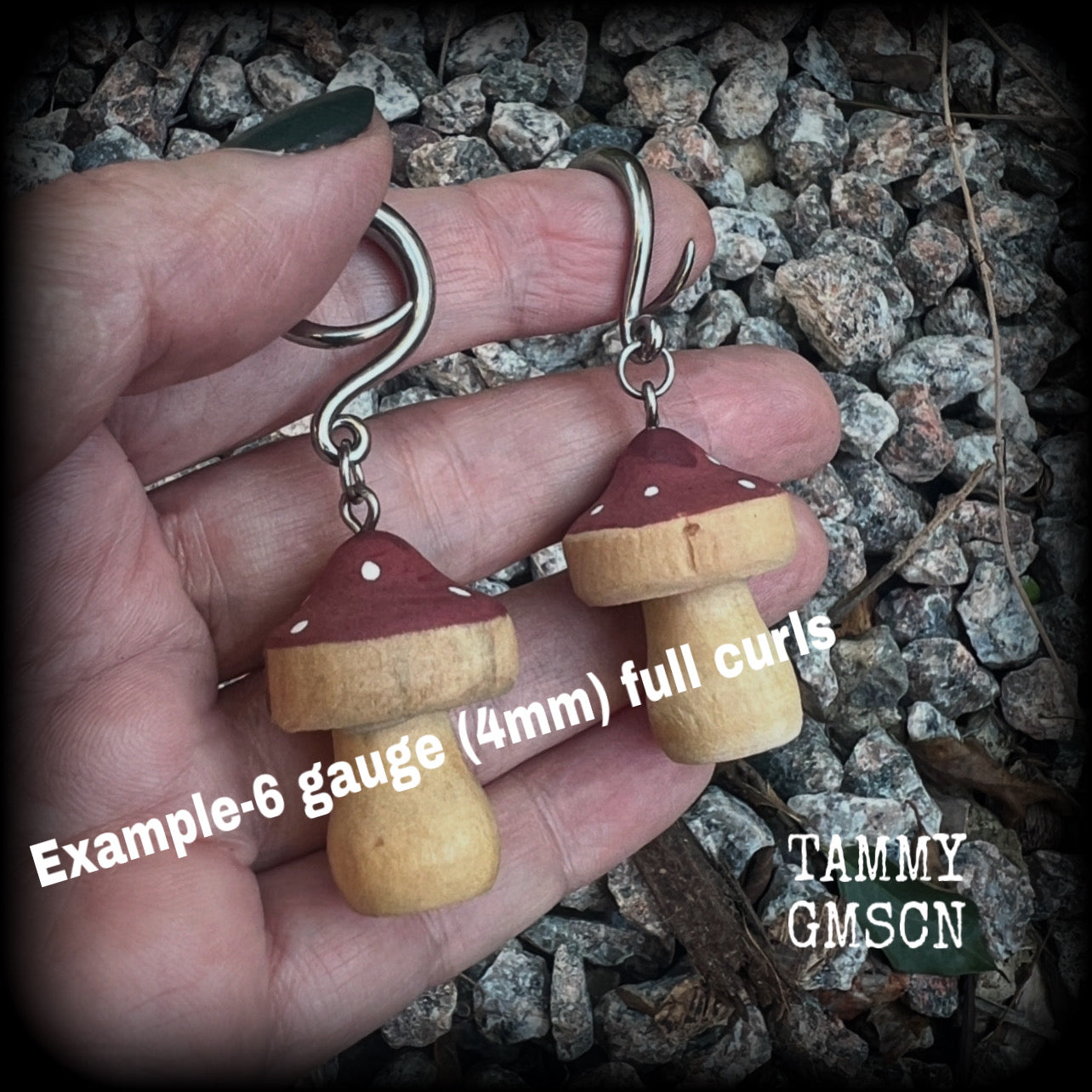 This pair of earrings features gorgeous dusty pink wood mushrooms, nice and light weight at 7 grams a piece, and nice and dangly at just on 6.5cms from tip to tip.

This pair has been made on 6 gauge (4mm) surgical steel full curl hooks, suitable for stretched lobes.