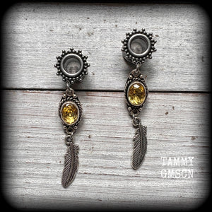 These beautiful boho tunnel earrings feature gorgeous antique silver feathers dangling from sparkly yellow citrine gemstones, weighing approx 6 grams each and measure 6.5cms from tip to tip.
This pair has been made with 0 gauge (8mm) gauge ornate surgical steel screw fit tunnels.