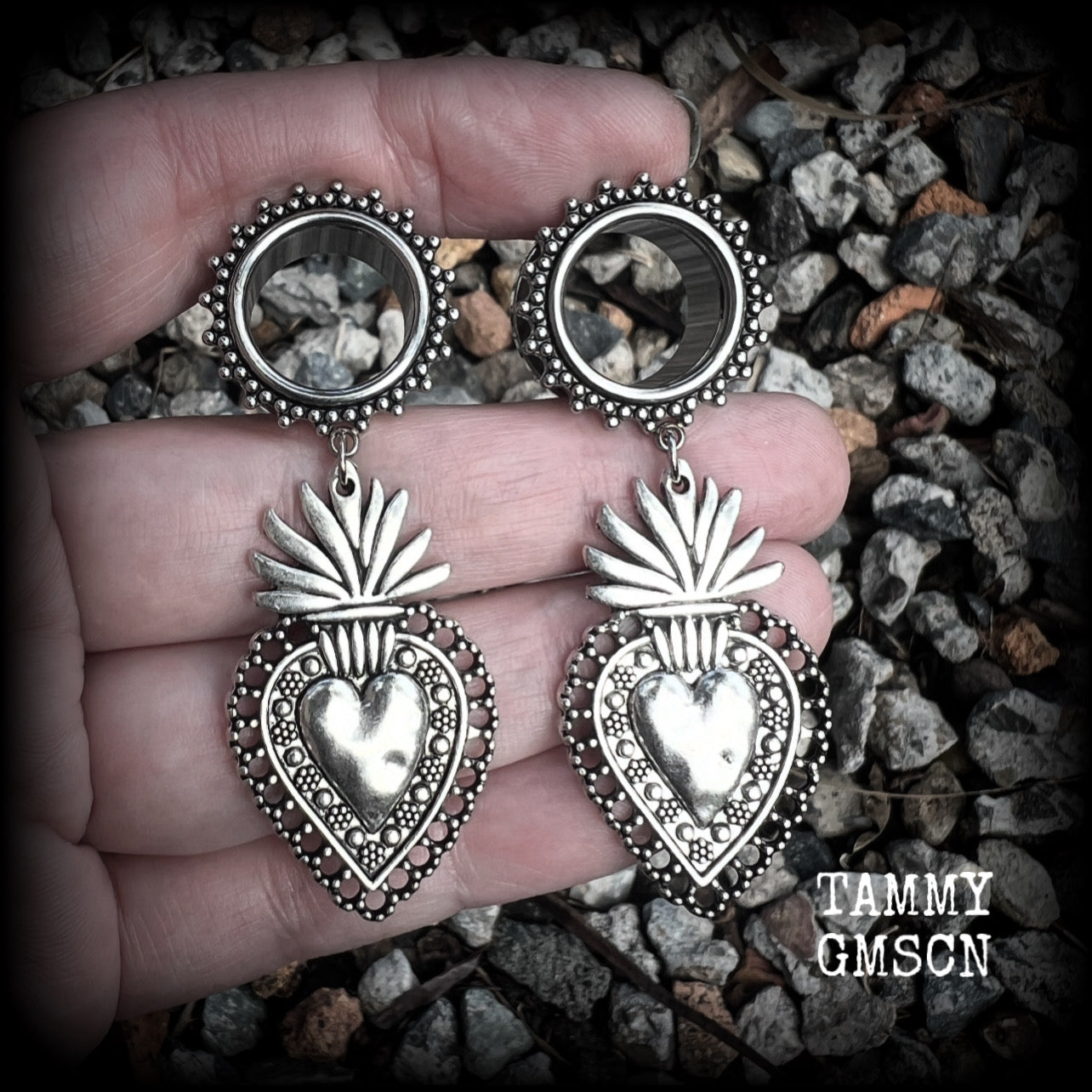 These gorgeous tunnel earrings feature beautiful antique silver sacred hearts, are nice and lightweight, weighing approx 10 grams each and measure just under 7cms from tip to tip.

This pair has been made with 9/16" (14mm) gauge ornate surgical steel screw fit tunnels.