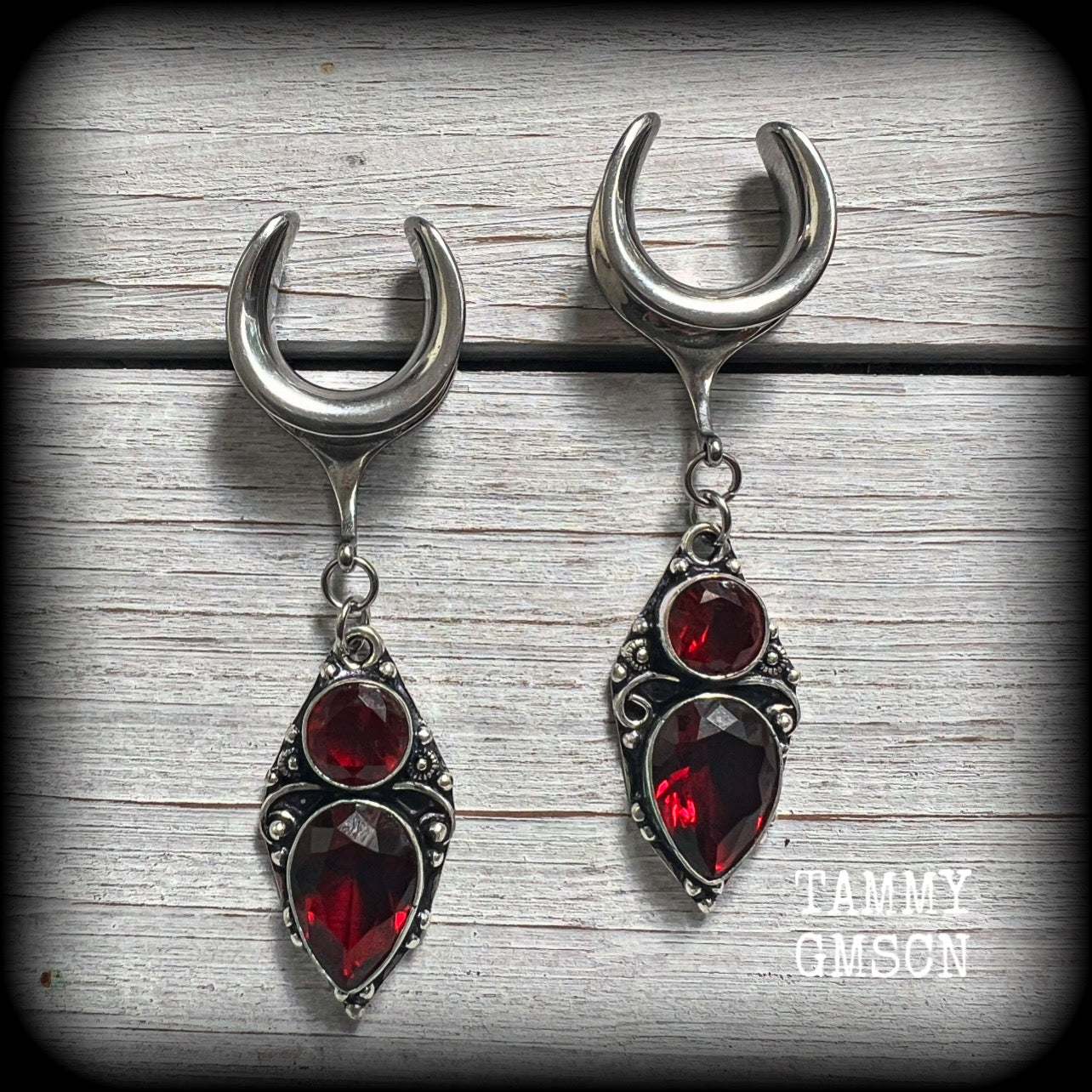 These beautiful boho Garnet ear hangers are made with gorgeous facet gemstones in a beautiful boho antique silver setting, measuring just on 6.5cms from tip to tip, and weighing only 9 grams each, nice and lightweight.

These earrings have been made on 5/8" gauge (16mm) surgical steel cradles, to be worn in stretched lobes.