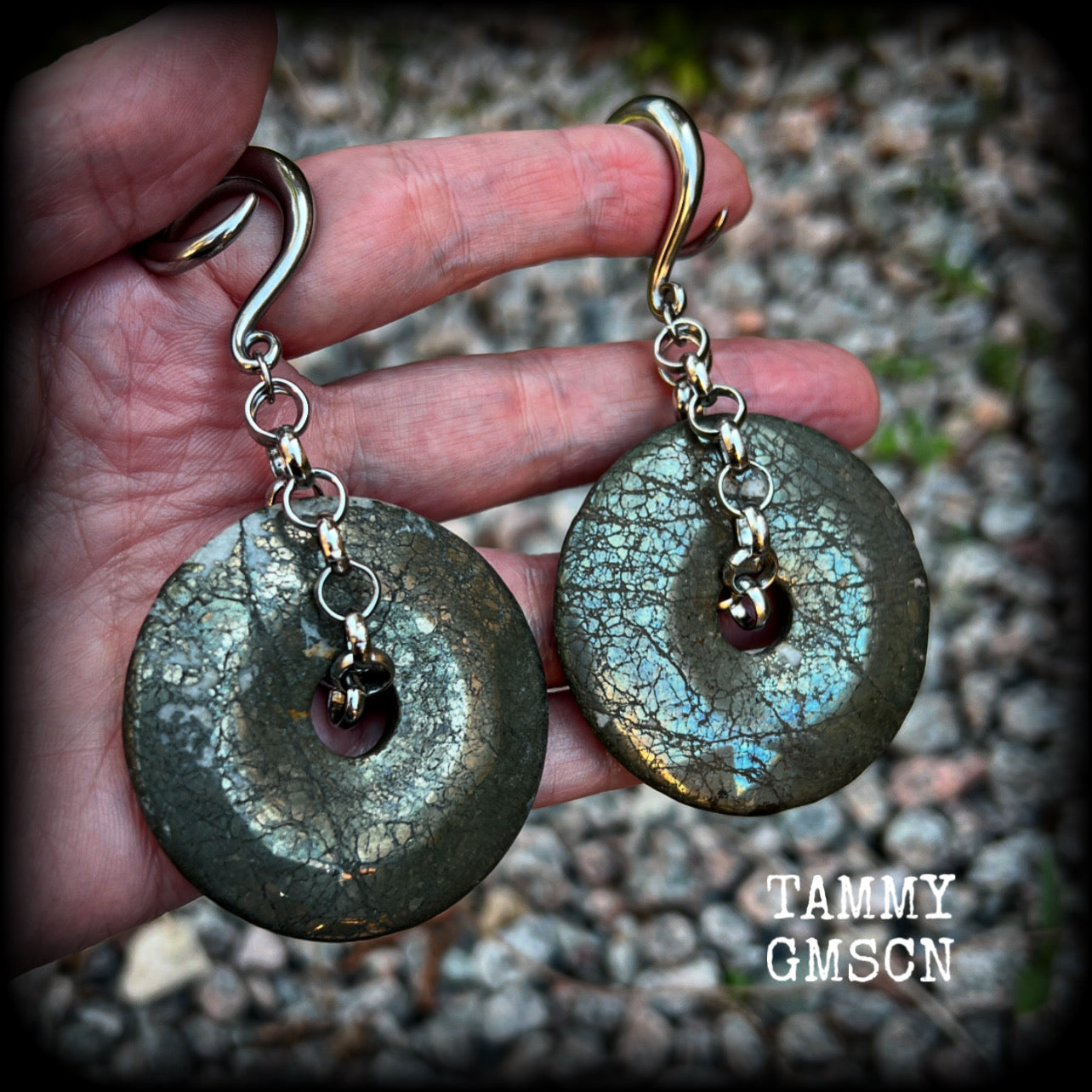 These beautiful big gauged earrings feature gorgeous Pyrite donut gemstones cradles in chunky antique silver chain, measuring just over 9cms from tip to tip, and weighing approx 55 grams each.

This pair has been made on 2 gauge (6mm) surgical steel full curls, to be worn in stretched lobes.
