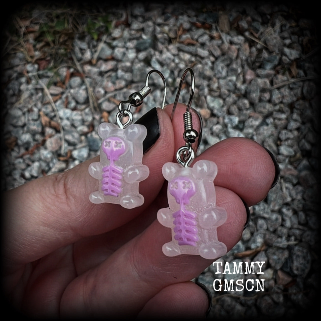 Featuring spooky cute pink skeleton gummy bears, these adorable earrings measure just on 5cms from tip to tip and are super light weight, weighing only a gram or two each.

This pair has been made with stainless steel french hooks, to be worn in pierced ears.
