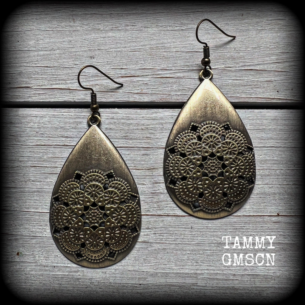 These beautiful teardrop earrings feature an intricate antique bronze mandala, are nice and light weight, weighing 6 grams each, and measuring just on 7 cms from tip to tip.
This pair have been made with antique french hooks, suitable for pierced ears.