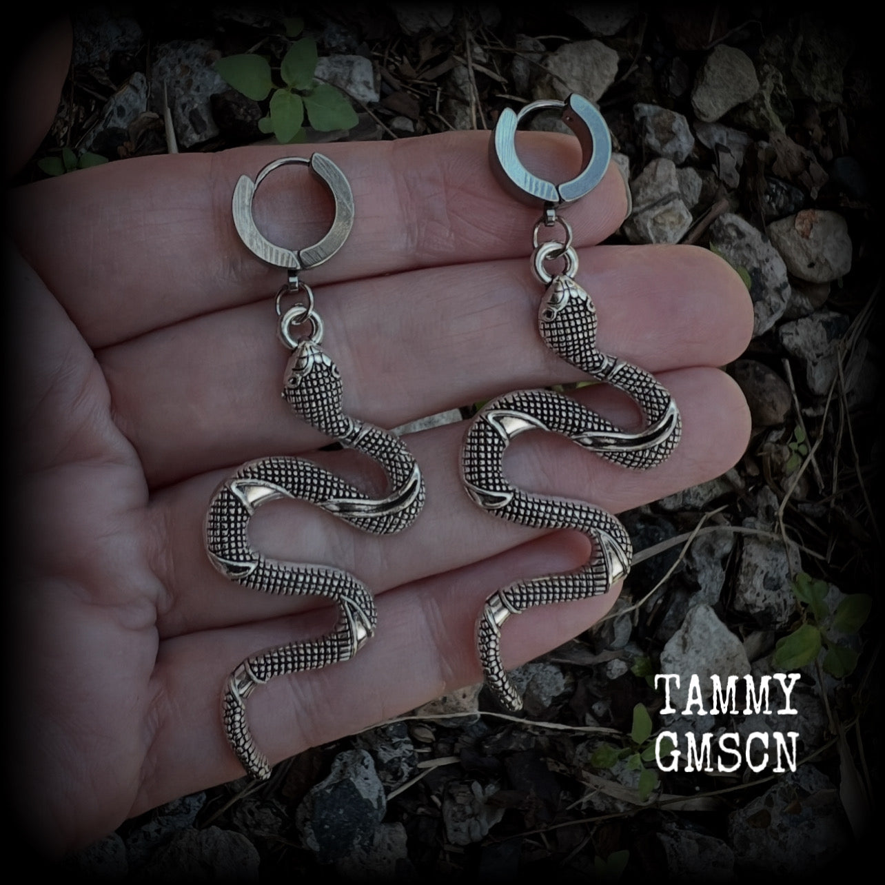 These awesome earrings feature an antique silver snake, are nice and lightweight at 7 grams each, and measure in at approx 7cms from tip to tip.

This pair have been made on stainless steel huggie ear cuffs, suitable for pierced ears.